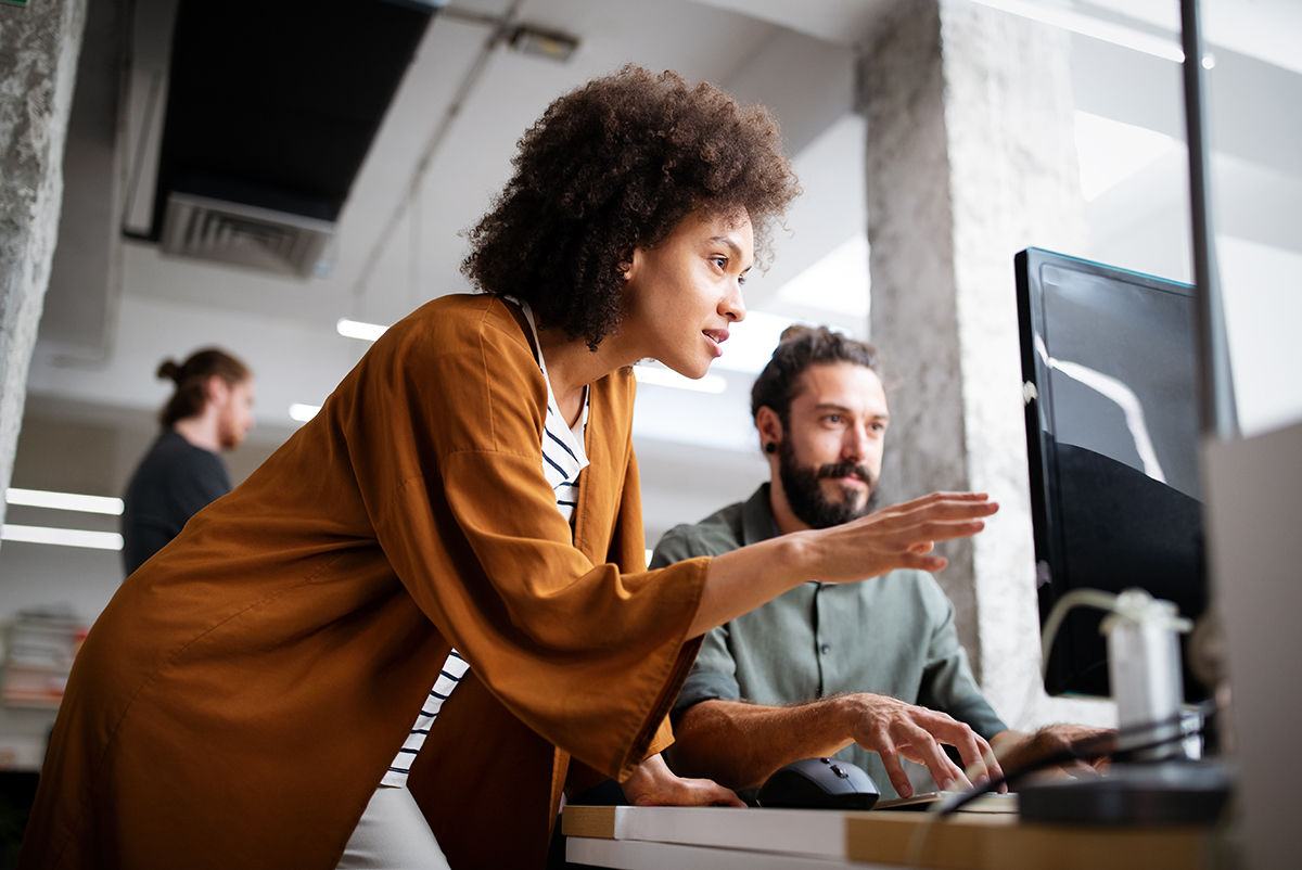 Two people working at a computer