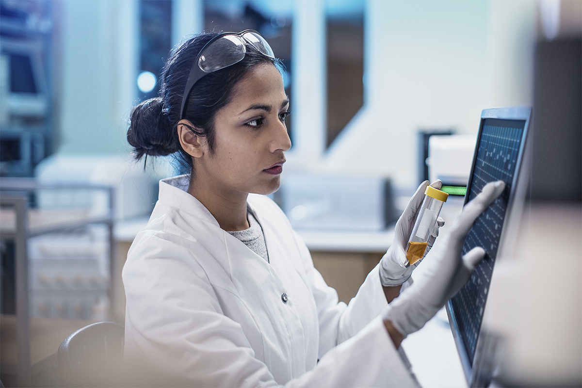 Female technician entering data samples