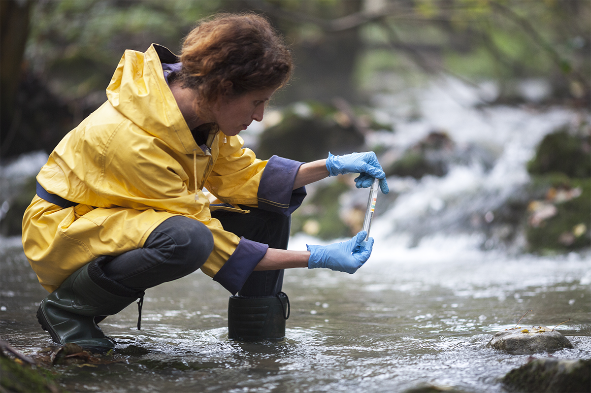 Woman taking a water sample