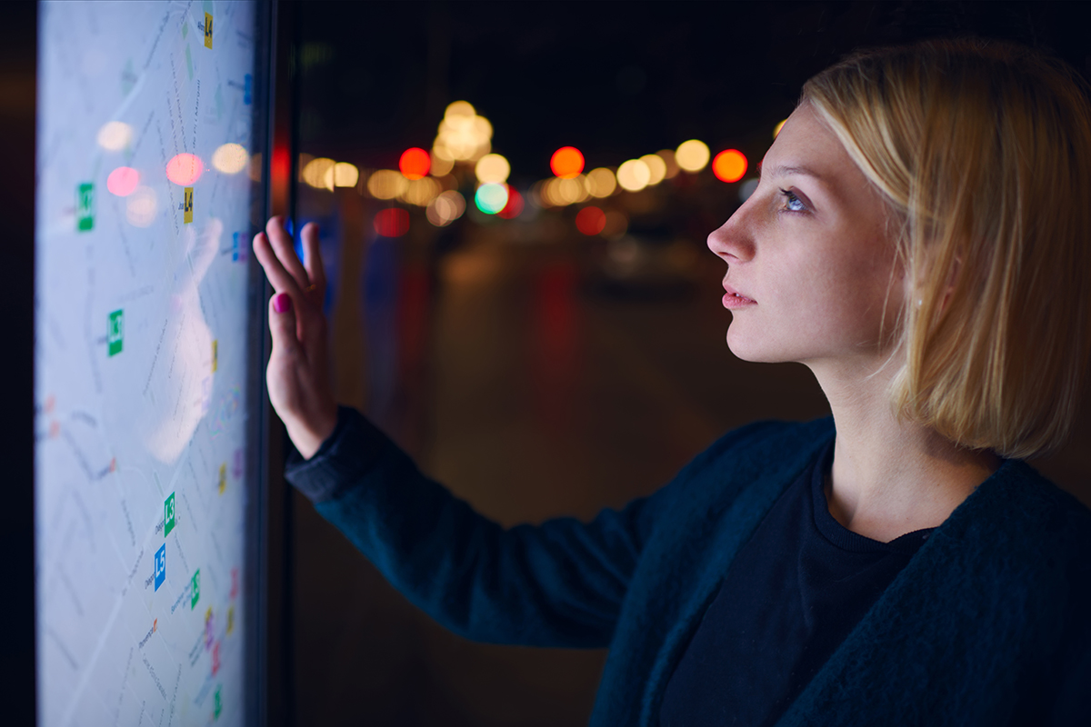 Female using a touch screen device