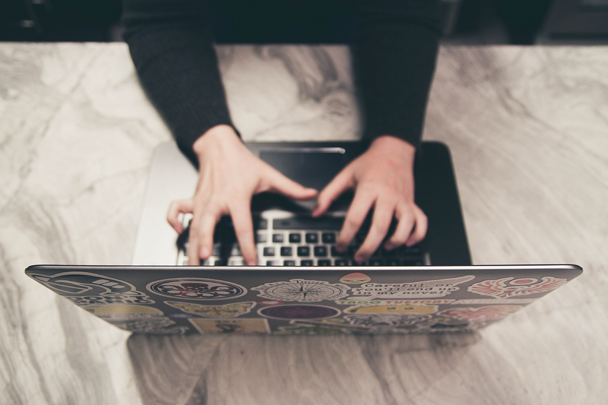 Person typing on a laptop